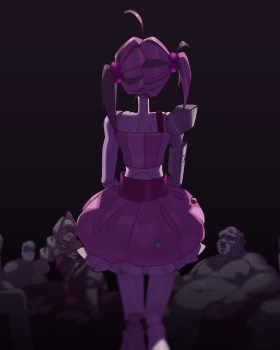 A doll walking onto the stage before the crowd